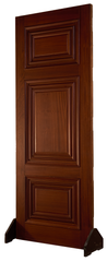 Classic interior door with three raised rectangular panels and ornate layered molding in a rich dark finish